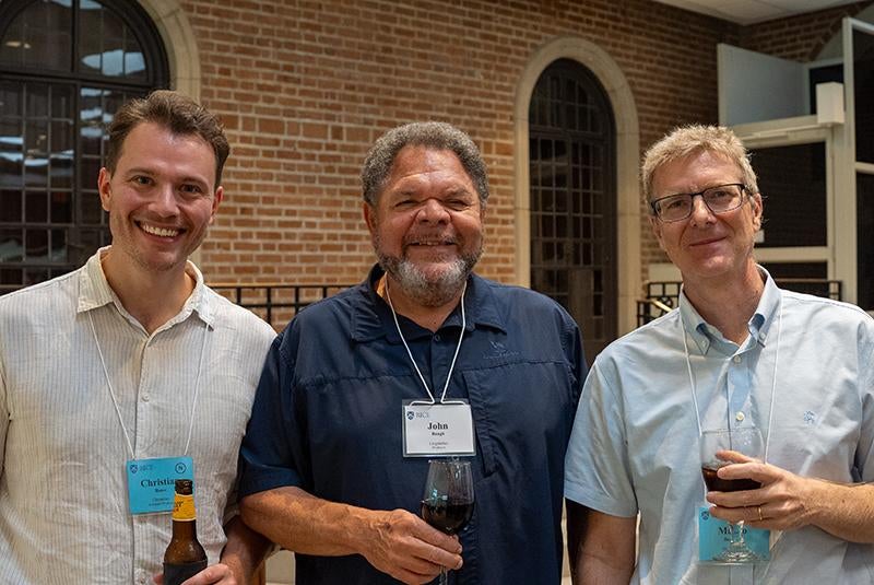 Two new and one current faculty at Provost's Reception