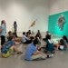Rice faculty and their kids enjoy a book reading at the Moody Center